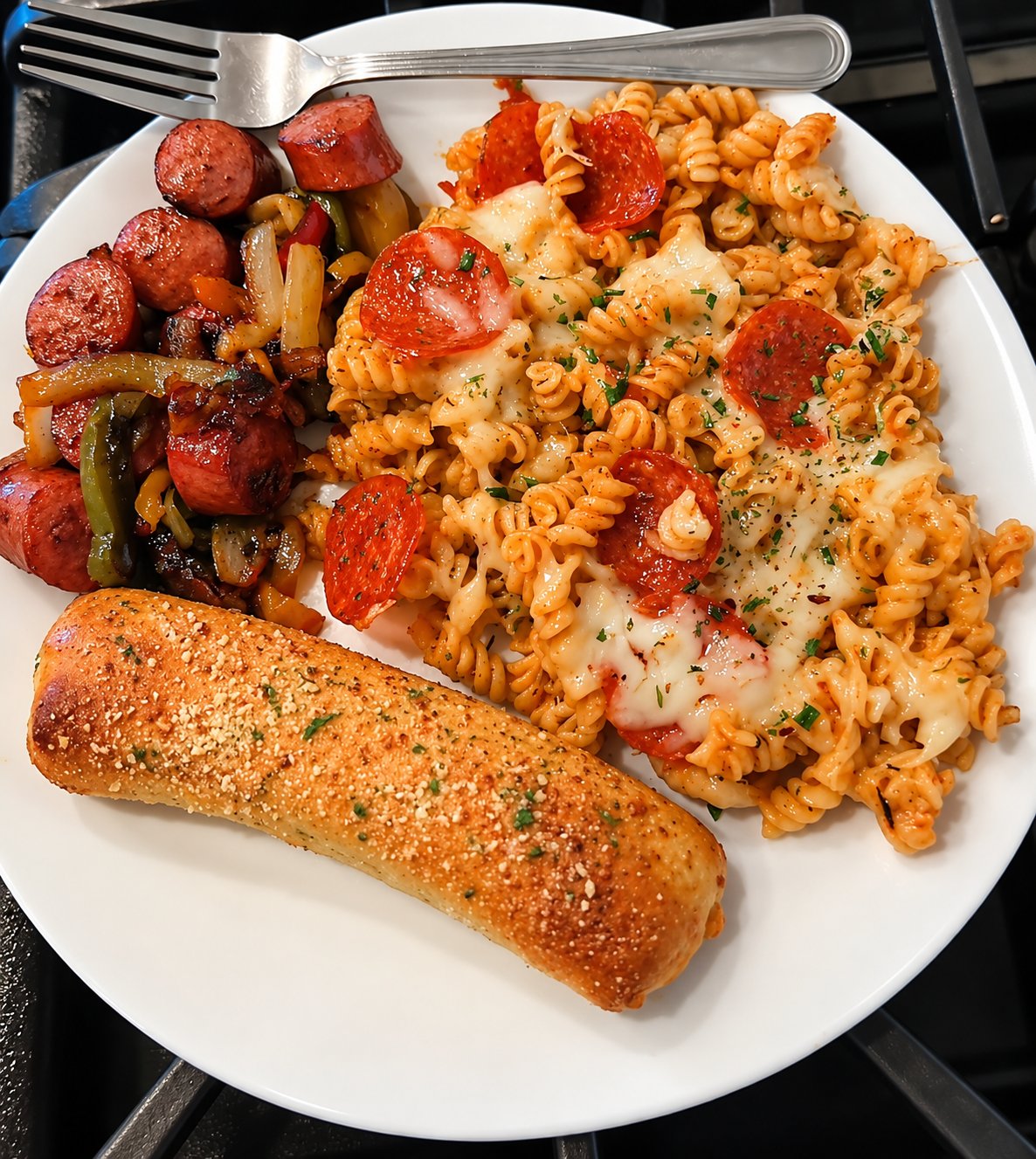 Pizza mac-and-cheese with pepperoni, sausage and peppers, and a breadstick